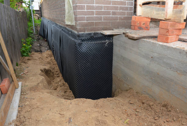 Happy homeowners after waterproofing job in Sugar Grove